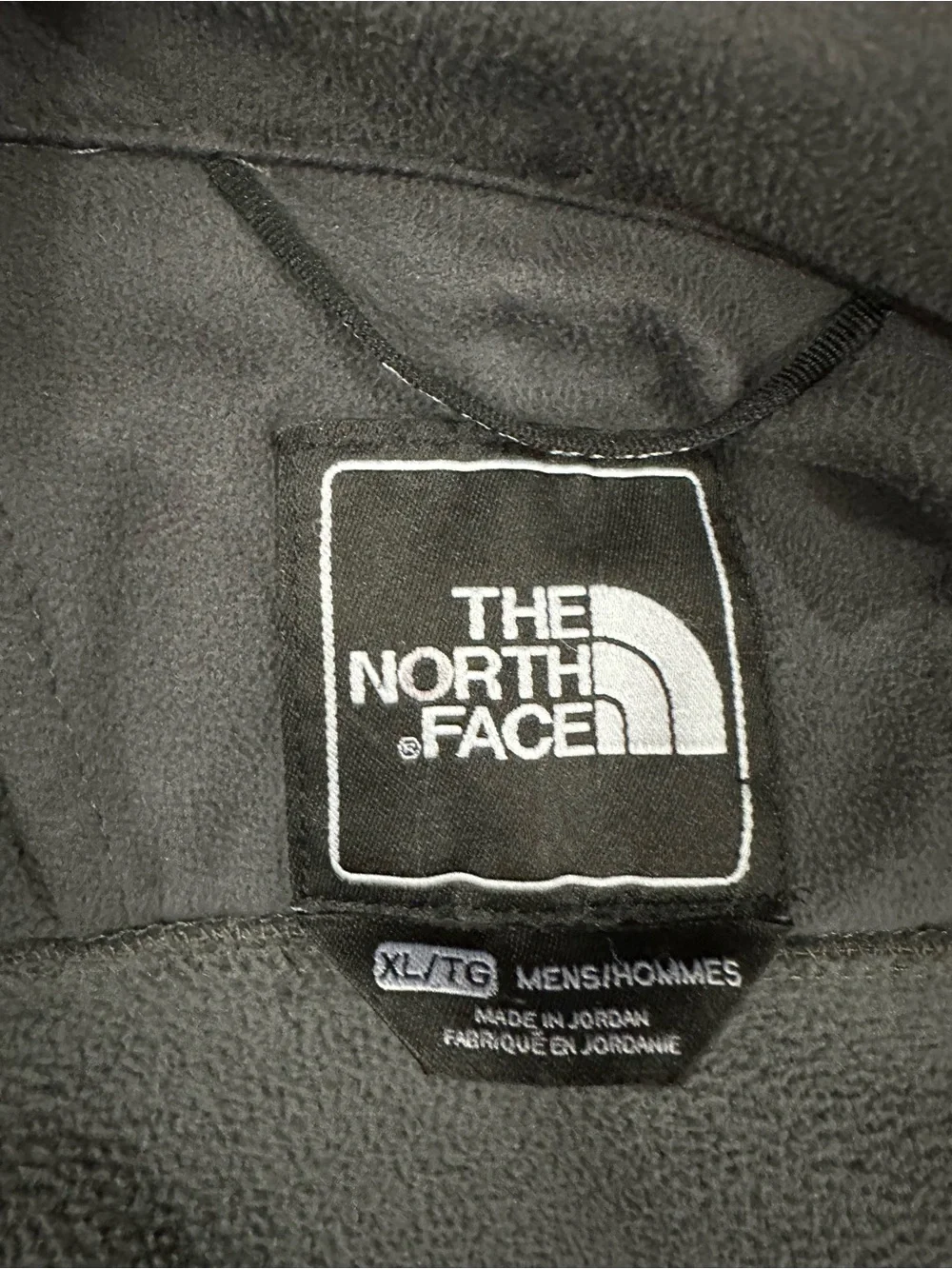 The North Face Men's Charcoal Gray Jacket with Blue Zippers